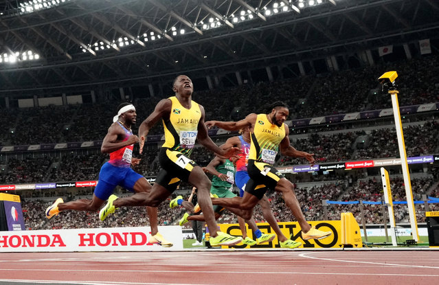 Jamaica's Oblique Seville crosses the finish line to win the final ahead of second placed Jamaica's Kishane Thompson and third placed Noah Lyles of the U.S on September 14, 2025. (Photo by Pawel Kopczynski/Reuters)