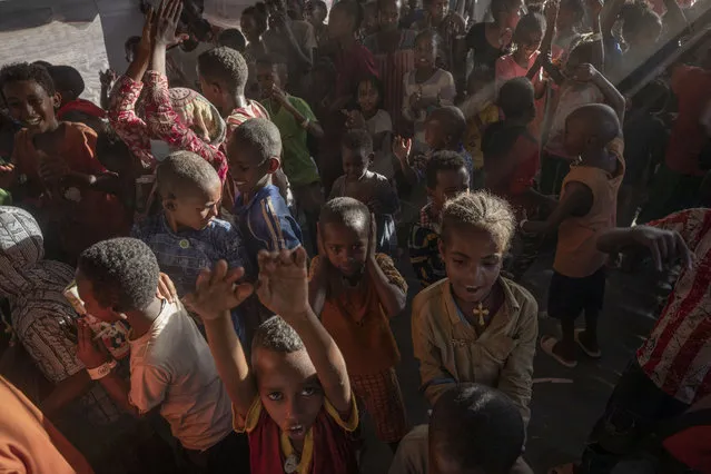 Tigray refugee children sing and dance inside a tent run by UNICEF for children's activities, in Umm Rakouba refugee camp in Qadarif, eastern Sudan, Thursday, December 10, 2020. (Photo by Nariman El-Mofty/AP Photo)