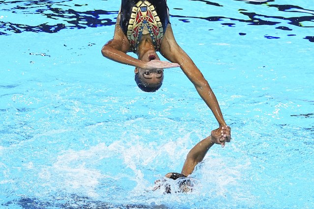 Egyptian competitors perform in the team acrobatic preliminary of artistic swimming at the World Aquatics Championships in Singapore, Thursday, July 24, 2025. (Photo by Ng Han Guan/AP Photo)