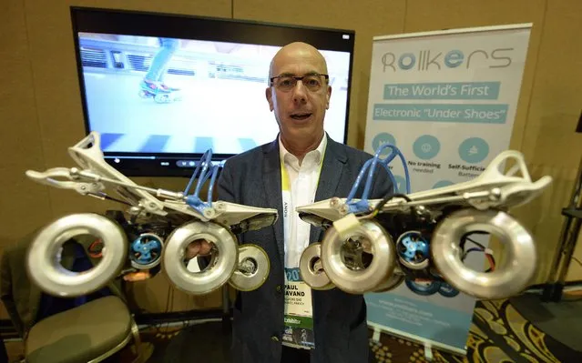 CEO of French company Rollkers holds up the World's First Electronic 'Under Shoe' which allows pedestrians to be automatically propelled along the street at the Unveiled press preview event for the 2015 International Consumer Electronics Show (CES) at the Mandalay Bay Convention Center in Las Vegas, Nevada, USA, 04 January 2015.(Photo by Michael Nelson/EPA)