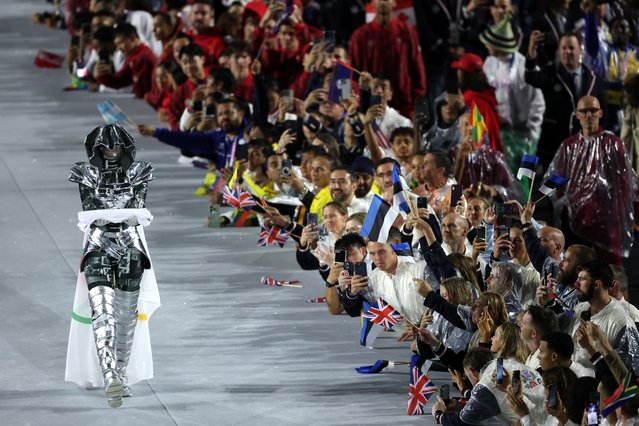 The Olympic Flag is presented by the The Horsewoman at Place du Trocadero during the opening ceremony of the Olympic Games Paris 2024 on July 26, 2024 in Paris, France. (Photo by Jamie Squire/Getty Images)