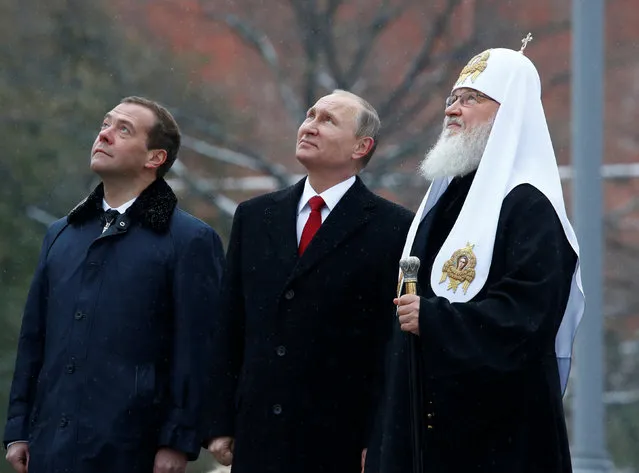 Russian President Vladimir Putin, Prime Minister Dmitry Medvedev and Patriarch Kirill, the head of the Russian Orthodox Church, attend a ceremony to unveil a monument of grand prince Vladimir I, who initiated the christianization of Kievan Rus' in 988 AD, on National Unity Day in central Moscow, Russia, November 4, 2016. (Photo by Sergei Karpukhin/Reuters)