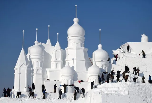 Artists make preparation for the 28th Sun Island snow sculpture exposition in Harbin, northeast China's Heilongjiang Province on December 8. 2015. The main snow sculpture, which measures 119 meters in length, 18 meters in width and 29 meters in height, is expected to be finished in the middle of this month. (Photo by Wang Jianwei/Xinhua via ZUMA Wire)