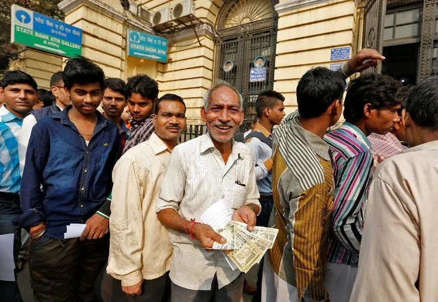 People queue outside a branch of the State Bank of india  to exchange old high denomination bank notes in Old Delhi, India, November 10, 2016. (Photo by Cathal McNaughton/Reuters)