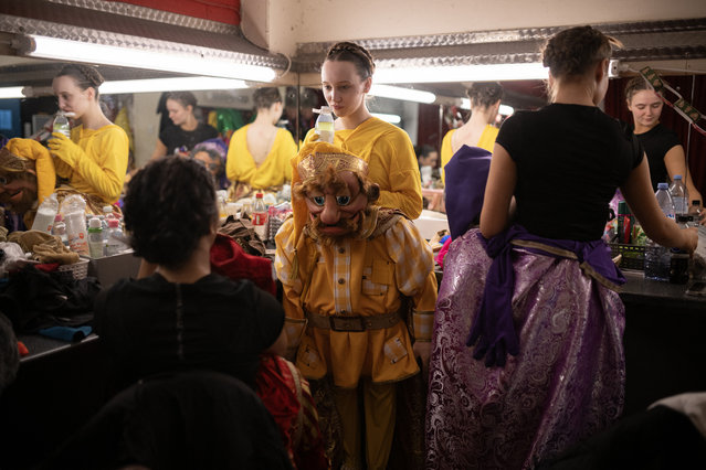 Actors performing as the seven dwarfs in the Christmas pantomime “Snow White and the Seven Dwarfs”, prepare their costumes and makeup backstage as they prepare to perform at St Helens Theatre Royal, in St Helens, north west England, on December 5, 2024. Built by architect Frank Matcham in the 19th Century the Theatre Royal is the principal theatre in St Helens with 700 seats over two tiers. The production of Snow White and the Seven Dwarfs is set to run until January 12, 2025. (Photo by Oli Scarff/AFP Photo)