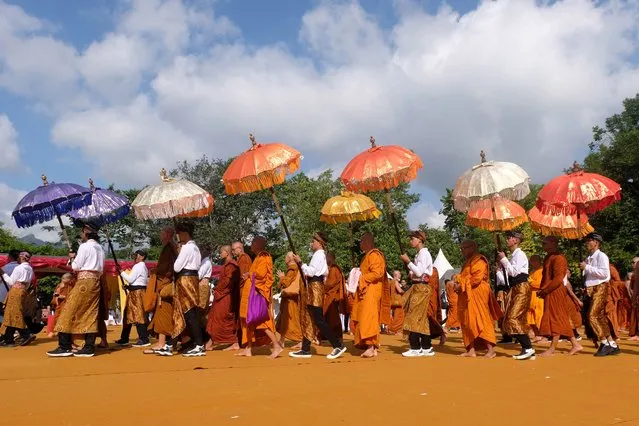 Buddhist monks walk at the Borobudur Temple complex during the celebration of Vesak day in Magelang, Central Java province, Indonesia on June 4, 2023, in this photo taken by Antara Foto. (Photo by Anis Efizudin/Antara Foto via Reuters)