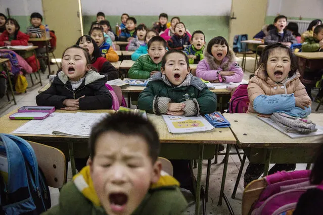 Chinese students who are children of migrants take part in classes at an un-official school on December 18, 2015 in Beijing, China. (Photo by Kevin Frayer/Getty Images)