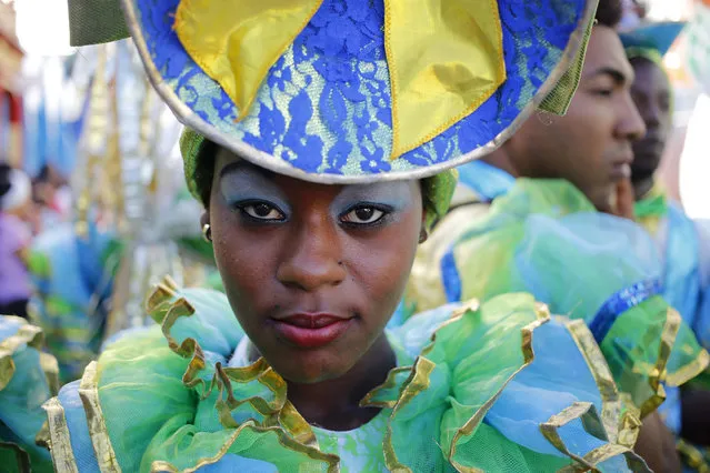 A member of the LGBT community strikes a pose while waiting for the start of a parade marking the International Day Against Homophobia, Transphobia and Biphobia, in Pinar Del Rio, Cuba, Thursday, May 17, 2018. (Photo by Desmond Boylan/AP Photo)