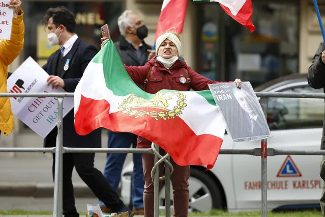 Demonstrators of an Iranian opposition group protest near the Grand Hotel Wien where closed-door nuclear talks with Iran take place, in Vienna, Austria, Thursday, April 15, 2021. (Photo by Lisa Leutner/AP Photo)