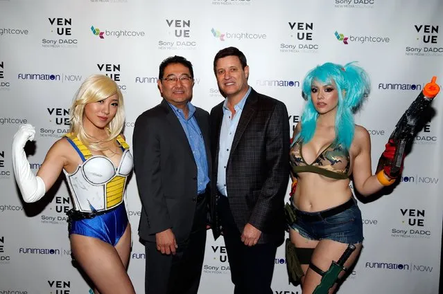 Funimation Founder and CEO Gen Fukunaga (L) and COO Mike DuBoise pose with characters as they arrive at the FunimationNow 2016 CES launch party on January 7, 2016 in Las Vegas, Nevada. (Photo by Isaac Brekken/Getty Images for Funimation Entertainment)