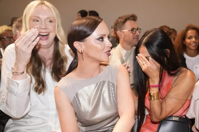 From left, the actresses Gwendoline Christie, Christina Ricci and Demi Moore find the proceedings amusing at the Fendi women's Spring/Summer 2024 fashion show in Milan, Italy on September 20, 2023. (Photo by Antonio Calanni/AP Photo)