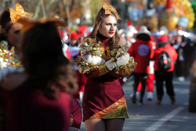 A participant tries to stay warm during the Macy's Thanksgiving Day Parade in Manhattan,New York, U.S., November 22, 2018. (Photo by Brendan McDermid/Reuters)