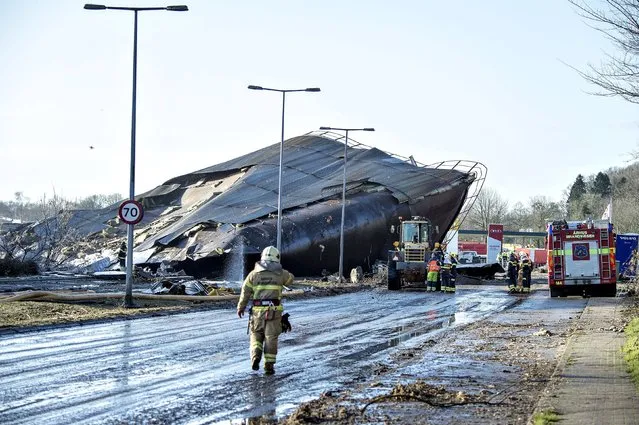 A fertilizer silo destroyed by a fire blocks a road in the port of Fredericia, Denmark February 4, 2016. According to local media, the fire broke out in several palm oil silos at the port resulted in a tanker explosion on Wednesday night and caused a lockdown at the harbour. (Photo by Henning Bagger/Reuters/Scanpix Denmark)