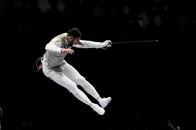 Alaaeldin Abouelkassem of Egypt celebrates after winning a men's individual round of 16 Foil competition at the 2020 Summer Olympics, Monday, July 26, 2021, in Chiba, Japan. (Photo by Andrew Medichini/AP Photo)