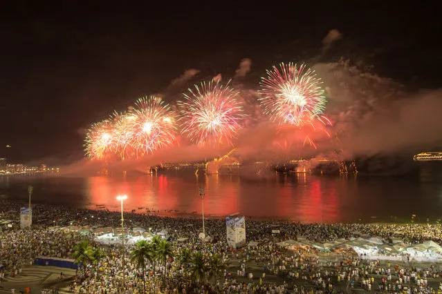 Fireworks light up the sky near Copacabana of Rio de Janeiro ringing in the New Year in Brazil, January 1, 2014. (Photo by Xu Zijian/Xinhua/ZumaPress.com)