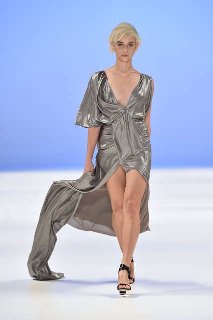 A model walks the runway in a design by Sara Aljaism at the Raffles International Showcase show at Mercedes-Benz Fashion Week Australia 2015 at Carriageworks on April 16, 2015 in Sydney, Australia. (Photo by Stefan Gosatti/Getty Images)