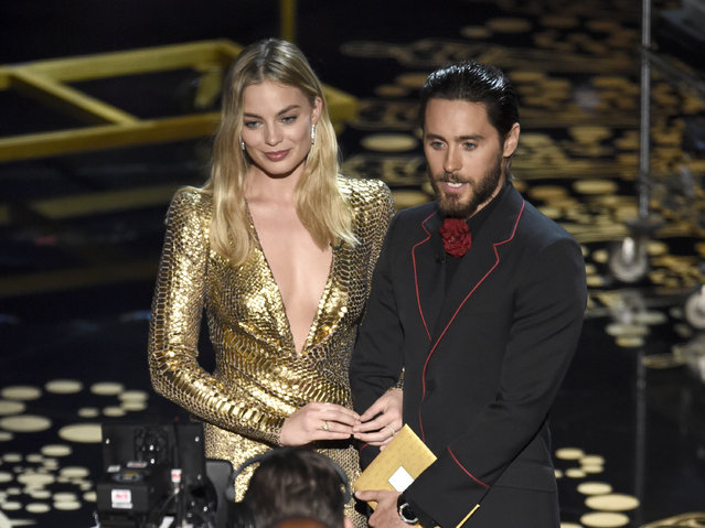 Margot Robbie, left, and Jared Leto present the award for best makeup and hairstyling at the Oscars on Sunday, February 28, 2016, at the Dolby Theatre in Los Angeles. (Photo by Chris Pizzello/Invision/AP Photo)