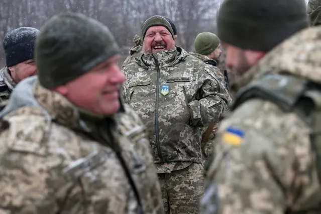 Air Defence Ukrainian servicemen, who took part in the defence operations during recent attacks on the Kyiv region, react during a meeting with the Commander of the Joint Forces of the Armed Forces of Ukraine, Lieutenant General Sergiy Nayev (not pictured), near Kyiv, on January 3, 2024, amid the Russian invasion in Ukraine. Deadly air strikes hit residential buildings in Ukraine on January 2, 2024, in an escalation of aerial attacks that killed five people and 130 wounded. (Photo by Anatolii Stepanov/AFP Photo)