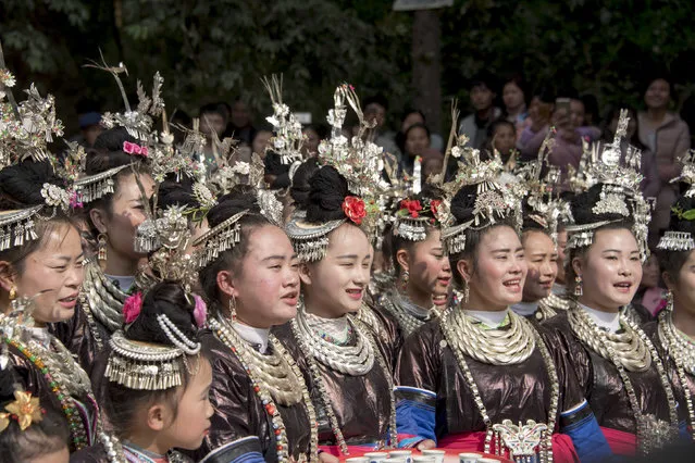 In this photo taken on January 28, 2017, Dong ethnic minority women celebrate the Lunar New Year in Congjiang, Guizhou province. China is marking the beginning of the Lunar New Year, the Year of the Rooster. (Photo by AFP Photo/Stringer)