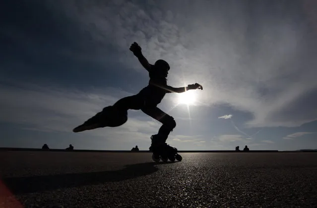 A man skates on the Promenades Des Anglais on a warm and sunny winter day in Nice, France, February 23, 2016. (Photo by Eric Gaillard/Reuters)
