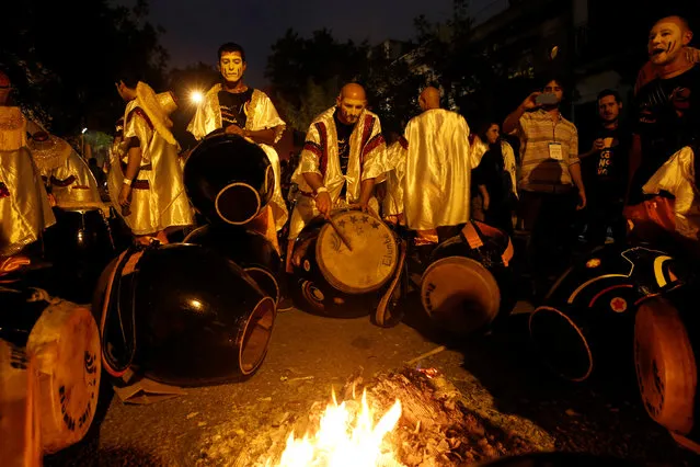 Members of a comparsa, a Uruguayan carnival group, tune their drums before the Llamadas parade, a street fiesta with traditional Afro-Uruguayan roots, in Montevideo February 10, 2017. (Photo by Andres Stapff/Reuters)