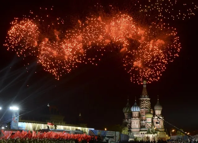Fireworks explodes over Red Square, with St. Basil's Cathedral seen on the background, during the Victory Day celebrations in Moscow, Russia, May 9, 2015. (Photo by Reuters/Host Photo Agency/RIA Novosti)