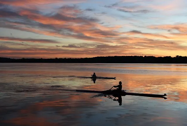 Rowers glide along the Potomac River at dawn on Wednesday October 20, 2021 in Alexandria, VA. The race for Governor of Virginia is a microcosm of the issues that are important to voters nationally. (Photo by Matt McClain/The Washington Post)