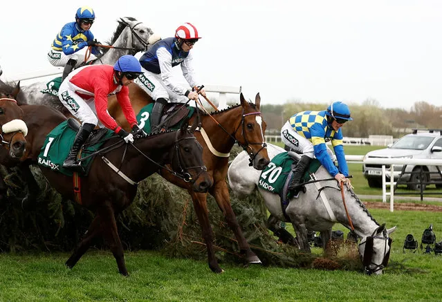 James Bowen, riding Bill Baxter, falls during a race at the Grand National Festival inside Aintree racecourse in Liverpool, Britain on April 12, 2024. (Photo by Jason Cairnduff/Action Images via Reuters)