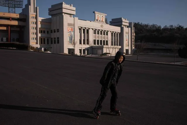 A child roller-blades before Kim Il-Sung stadium in Pyongyang on February 17, 2017. (Photo by Ed Jones/AFP Photo)