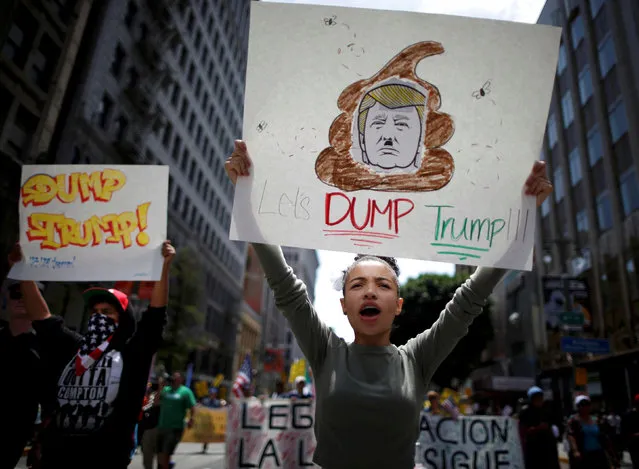People march with posters against Republican presidential candidate Donald Trump during an immigrant rights May Day rally in Los Angeles, California, U.S., May 1, 2016. (Photo by Lucy Nicholson/Reuters)