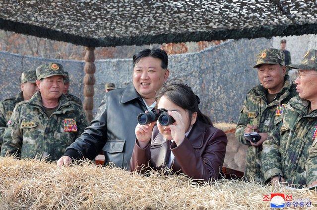 This picture taken on March 15, 2024 and released from North Korea's official Korean Central News Agency (KCNA) on March 16 shows North Korean leader Kim Jong Un (centre L) and his daughter Ju Ae (centre R) inspecting a training of the Korean People's Army at an undisclosed location in North Korea. (Photo by KCNA via KNS/AFP Photo)