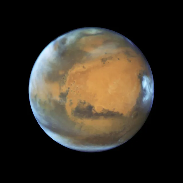 This May 12, 2016 image provided by NASA shows the planet Mars. On Sunday, May 22, 2016, the sun and Mars will be on exact opposite sides of Earth. (Photo by NASA/ESA/Hubble Heritage Team – STScI/AURA, J. Bell – ASU, M. Wolff – Space Science Institute via AP Photo)