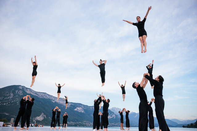 Dancers and acrobats perform during the Möbius Morphosis show by Rachid Ouramdane and Compagnie XY at the Paquier on July 09, 2024 in Annecy, France. (Photo by Richard Bord/Getty Images)