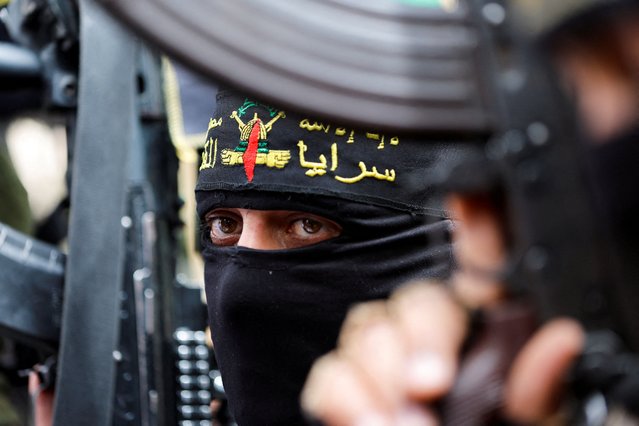 Palestinian Islamic Jihad militants take part in a rally to celebrate the shooting attacks in Israel, in Khan Younis, in the southern Gaza Strip on April 8, 2022. (Photo by Ibraheem Abu Mustafa/Reuters)