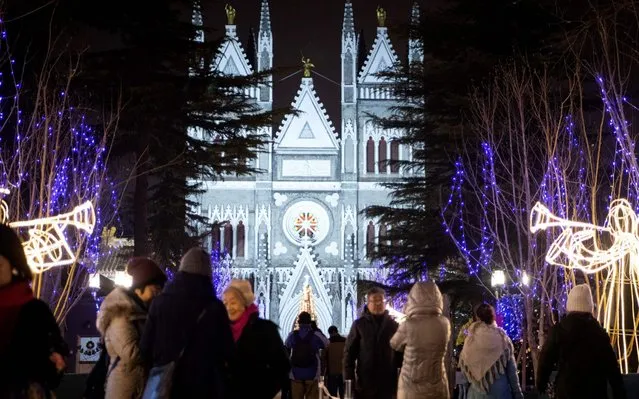 The Xishiku Cathedral is decorated with lights for a Christmas eve mass in Beijing on December 24, 2019. (Photo by Noel Celis/AFP Photo)