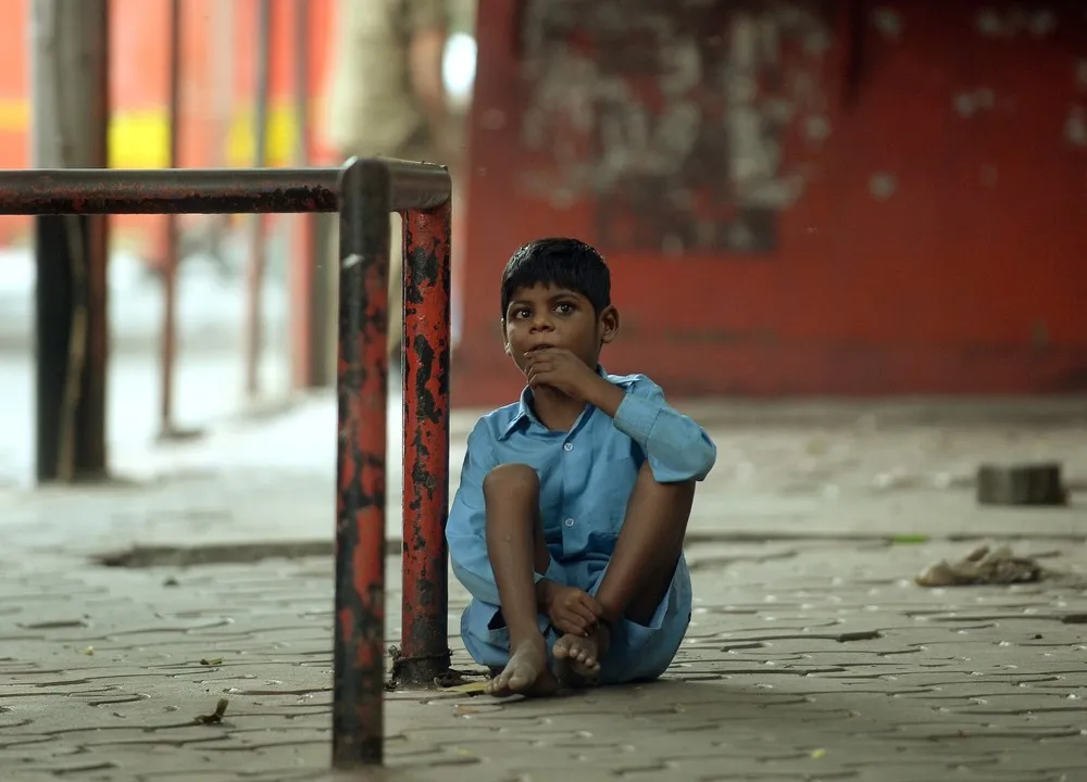 Disabled Indian Boy Tethered to Bus Stop as Grandmother Works