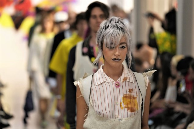 Models wear creations as part of the Simon Cracker men's and women's Spring Summer 2024 collection presented in Milan, Italy, Sunday, June 18, 2023. (Photo by Luca Bruno/AP Photo)