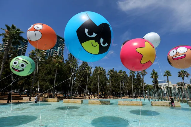 Workers set up balloons for  The Cartoon Network prior to the opening preview night  at Comic Con International in San Diego,California, U.S., July 19, 2017. (Photo by Mike Blake/Reuters)