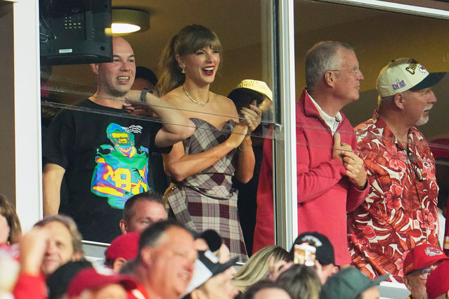 Taylor Swift cheers from a suite as the Kansas City Chiefs play the New Orleans Saints during the first half of an NFL football game at GEHA Field at Arrowhead Stadium on October 7, 2024 in Kansas City, Missouri. (Photo by Cooper Neill/Getty Images)