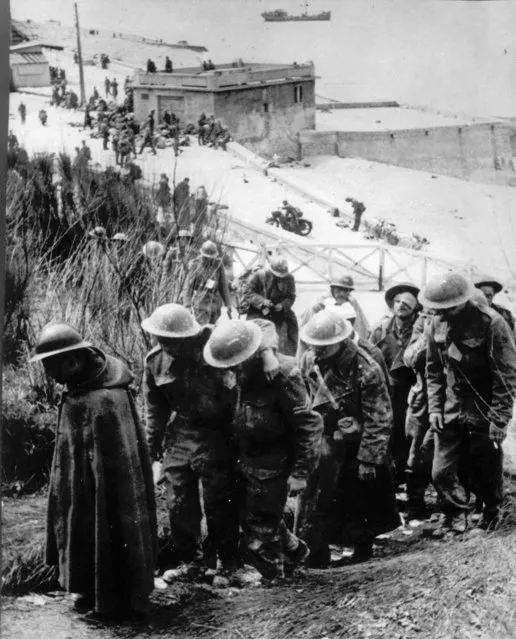 Captured British soldiers are led away by German troops at Dunkirk, France, in June 1940. (Photo by AP Photo)