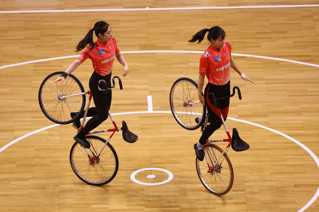 Cyclists from Hong Kong compete during the Women's Elite Pair Artistic Indoor Cycling Qualification round at the UCI World Championships 2023 in Glasgow, Scotland, on August 11, 2023. (Photo by Matthew Childs/Reuters)