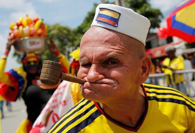 A supporter of Colombia shouts during the 2018 World Cup football qualifier match between Colombia and Brazil in Barranquilla, Colombia, on September 5, 2017. (Photo by Henry Romero/Reuters)