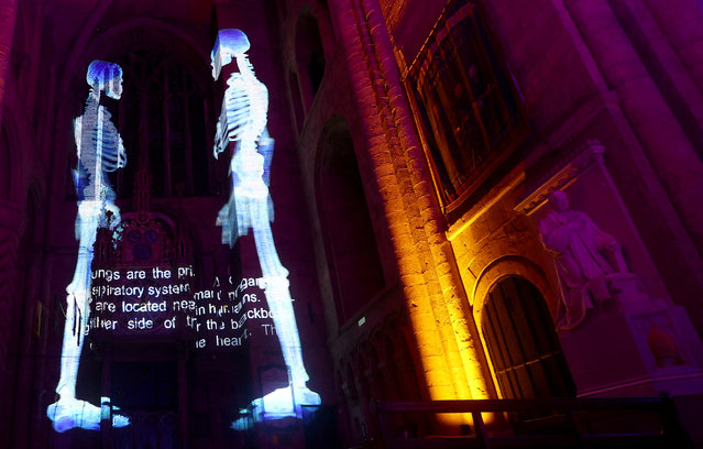 Art installation titled “Science” by Luxmuralis is pictured on display inside Durham Cathedral in Durham, Britain on October 10, 2023. (Photo by Lee Smith/Reuters)