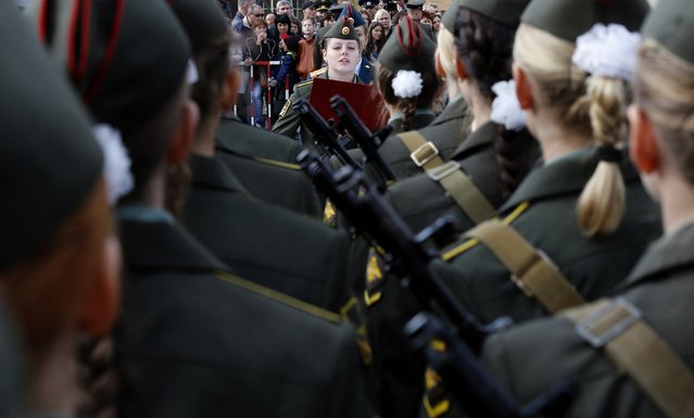 A first year cadet of the Military University of Communication takes the oath during a ceremony in St.Petersburg September 6, 2014. (Photo by Alexander Demianchuk/Reuters)