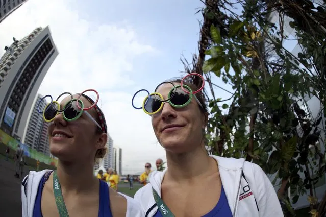 People wearing sunglasses featuring the Olympic rings are pictured at the Olympic Village in Rio de Janeiro, Brazil on August 3, 2016. (Photo by Edgard Garrido/Reuters)