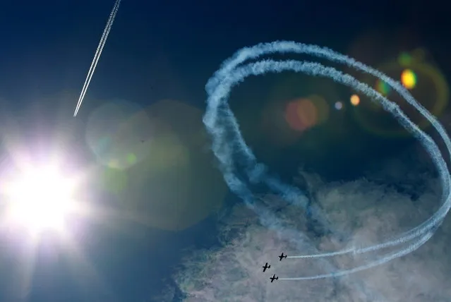 Aerobatic group “FireBirds” from Poland performs during an airshow in Nowy Targ, Tatra Region, Poland, August 17, 2014. (Photo by Grzegorz Momot/EPA)