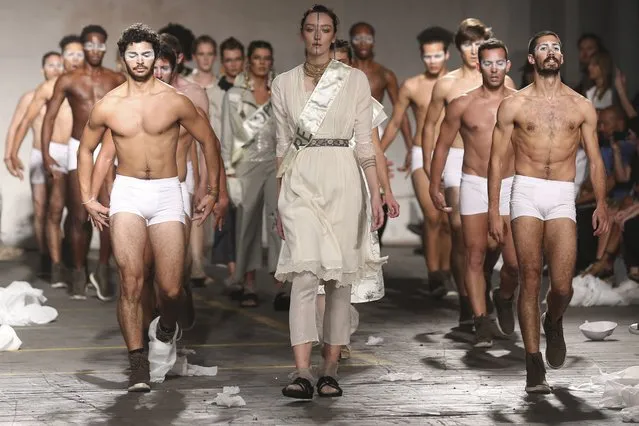 A model displays a creations surrounded by dancers during Portuguese designer Teresa Martins for TM Collection during her runway show at the 41st edition of the Portugal Fashion Event in Lisbon, Portugal, 14 October 2017. (Photo by Jose Sena Goulao/EPA/EFE)