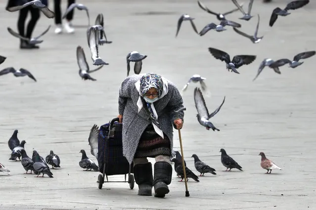 An elderly woman seen on a city street in Moscow, Russia on May 13, 2020. The self-isolation regime in Moscow has been extended until 31 May 2020 to combat the spread of the novel coronavirus (COVID-19). (Photo by Stanislav Krasilnikov/TASS via Getty Images)