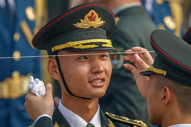 A soldier looks at a line during a ceremony to mark Martyrs' Day at the Tiananmen Square in Beijing, China, 30 September 2022. Martyr's Day is celebrated on the eve of National Day of the People's Republic of China to commemorate the people who sacrificed their lives in pursuit of national independence. (Photo by Mark R. Cristino/EPA/EFE)