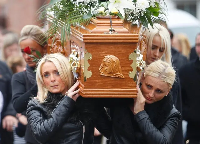 Friends and family carry the coffin of Kevin McKee to St. Peter's Cathedral in West Belfast, Northern Ireland, September 14, 2015. McKee was a teenager when he was kidnapped, killed and buried by the IRA more than four decades ago. (Photo by Peter Morrison/AP Photo)